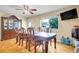 Dining room features a large table with view of the exterior and china cabinet at 7751 Niagara St, Commerce City, CO 80022