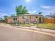Charming single-Gathering home featuring a fenced yard and inviting front porch at 7751 Niagara St, Commerce City, CO 80022