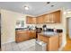 Well-lit kitchen features granite countertops, island, and modern appliances at 7751 Niagara St, Commerce City, CO 80022