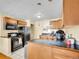Kitchen features ample counter space, updated appliances, and a convenient layout at 7751 Niagara St, Commerce City, CO 80022