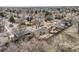 An aerial shot of the neighborhood showcasing the property's location among tree-lined streets and other homes at 8965 Jellison Ct, Broomfield, CO 80021