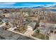 Aerial view showcases a neighborhood and lake views, emphasizing its desirable location and community at 8965 Jellison Ct, Broomfield, CO 80021