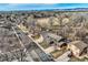 Extensive aerial view highlighting the neighborhood layout near the lake and park, conveying an inviting community at 8965 Jellison Ct, Broomfield, CO 80021