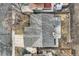 Overhead view of home with grey roof, patio, yard, driveway and mature tree at 8965 Jellison Ct, Broomfield, CO 80021