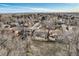 Expansive aerial view of a residential neighborhood with mature trees and well-maintained homes at 8965 Jellison Ct, Broomfield, CO 80021