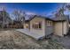 Cozy home exterior with a concrete patio and well-maintained yard, creating a charming outdoor setting at 8965 Jellison Ct, Broomfield, CO 80021
