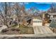 Inviting single-story home featuring a brick facade, attached garage, and mature trees in the front yard at 8965 Jellison Ct, Broomfield, CO 80021