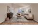 Inviting living room featuring hardwood floors and ample natural light, ideal for comfortable living and entertaining at 8965 Jellison Ct, Broomfield, CO 80021