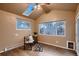 Bright sunroom with natural lighting, a skylight, wood floors, and room to relax at 8965 Jellison Ct, Broomfield, CO 80021