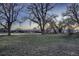 Large yard with mature trees, offering shade and privacy to this home at 8965 Jellison Ct, Broomfield, CO 80021