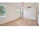 Inviting bedroom with large windows, fan, and adjacent bathroom and closet at 1272 Bluebird St, Brighton, CO 80601