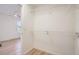 Walk-in closet features laminate floors, a wire shelf and rod system, and a view of the room beyond at 1272 Bluebird St, Brighton, CO 80601