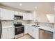 Well-lit kitchen featuring stainless steel appliances, quartz countertops, and marble backsplash at 1272 Bluebird St, Brighton, CO 80601