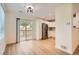 Bright kitchen with white cabinets, stainless steel appliances, and access to a deck at 1272 Bluebird St, Brighton, CO 80601