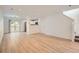 Spacious open floor plan with neutral paint, contemporary flooring, stairs, and access to the patio at 1272 Bluebird St, Brighton, CO 80601