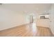 Open-concept living space featuring neutral paint and modern flooring into dining and kitchen at 1272 Bluebird St, Brighton, CO 80601