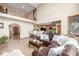 Open-concept living area with a view of the kitchen and hardwood flooring at 8901 Forrest Dr, Highlands Ranch, CO 80126