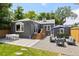 Spacious backyard with patio, lounge area, dining set, and well-maintained lawn at 1738 S Franklin St, Denver, CO 80210