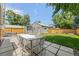 This backyard has a dining area, a lush lawn, and a shed at 1738 S Franklin St, Denver, CO 80210