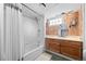Traditional bathroom featuring a bathtub, a vanity with mirror, and tiled walls at 1738 S Franklin St, Denver, CO 80210