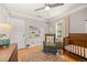 Cozy bedroom features hardwood floors, soft paint and ample lighting from a central fixture at 1738 S Franklin St, Denver, CO 80210