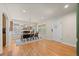 Spacious dining room with hardwood floors, a classic fireplace, and ample natural light at 1738 S Franklin St, Denver, CO 80210