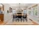 Elegant dining room with hardwood floors, fireplace, and a stylish chandelier at 1738 S Franklin St, Denver, CO 80210