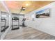Home gym featuring a treadmill, exercise bike, and mirrored wall at 1738 S Franklin St, Denver, CO 80210