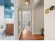 Hallway featuring hardwood floors, and an archway leading to other rooms at 1738 S Franklin St, Denver, CO 80210