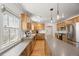Spacious kitchen features an island with stone countertops and stainless steel appliances at 1738 S Franklin St, Denver, CO 80210