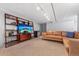 Relaxing living room with entertainment center, leather seating, and ample space at 1738 S Franklin St, Denver, CO 80210