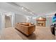 Open living room with a fireplace, comfortable seating, and access to the stairs at 1738 S Franklin St, Denver, CO 80210