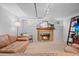 Inviting living room with a fireplace, a comfortable leather sofa, and ample natural light at 1738 S Franklin St, Denver, CO 80210