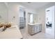 Elegant bathroom with dual vanities, modern fixtures, and ample counter space at 664 Saddle Dr, Erie, CO 80516