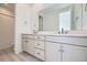 Modern bathroom featuring dual sinks, bright lighting, and sleek design at 664 Saddle Dr, Erie, CO 80516