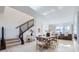 Open concept dining area with modern table and chairs, adjacent to the kitchen at 664 Saddle Dr, Erie, CO 80516