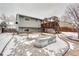 Backyard view featuring a deck and garden beds, showcasing outdoor space at 2152 Grant St, Longmont, CO 80501