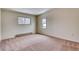 Bright bedroom with neutral tones, carpet, and windows, creating a serene and inviting space at 2152 Grant St, Longmont, CO 80501