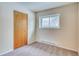 Bedroom with a window and closet providing ample natural light and storage space at 2152 Grant St, Longmont, CO 80501