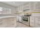 Bright kitchen featuring white cabinets, stainless steel appliances, and sleek countertops at 2152 Grant St, Longmont, CO 80501