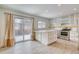 Open kitchen with a center island, stainless appliances, and sliding doors to the patio at 2152 Grant St, Longmont, CO 80501