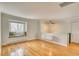 Bright living room featuring hardwood floors, a window seat, and stylish lighting at 2152 Grant St, Longmont, CO 80501