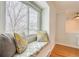 Cozy window seat with comfortable cushions, offering a relaxing view of the outdoors at 2152 Grant St, Longmont, CO 80501