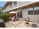 Cozy backyard patio with seating area and charming stone walkway at 10310 E Jewell Ave # 55, Aurora, CO 80247