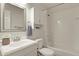 Clean white bathroom featuring a shower-tub combo and modern vanity at 10310 E Jewell Ave # 55, Aurora, CO 80247