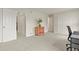 Bright bedroom with neutral carpet, white walls, and closet space at 10310 E Jewell Ave # 55, Aurora, CO 80247