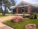 Community clubhouse featuring stone accents and a welcoming entrance at 10310 E Jewell Ave # 55, Aurora, CO 80247