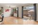 Bright dining area with hardwood floors and sliding glass door to the patio at 10310 E Jewell Ave # 55, Aurora, CO 80247