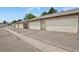 Row of garages with white doors and well-maintained exterior at 10310 E Jewell Ave # 55, Aurora, CO 80247