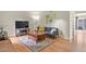 Comfortable living room with hardwood floors and a TV, perfect for relaxing at 10310 E Jewell Ave # 55, Aurora, CO 80247